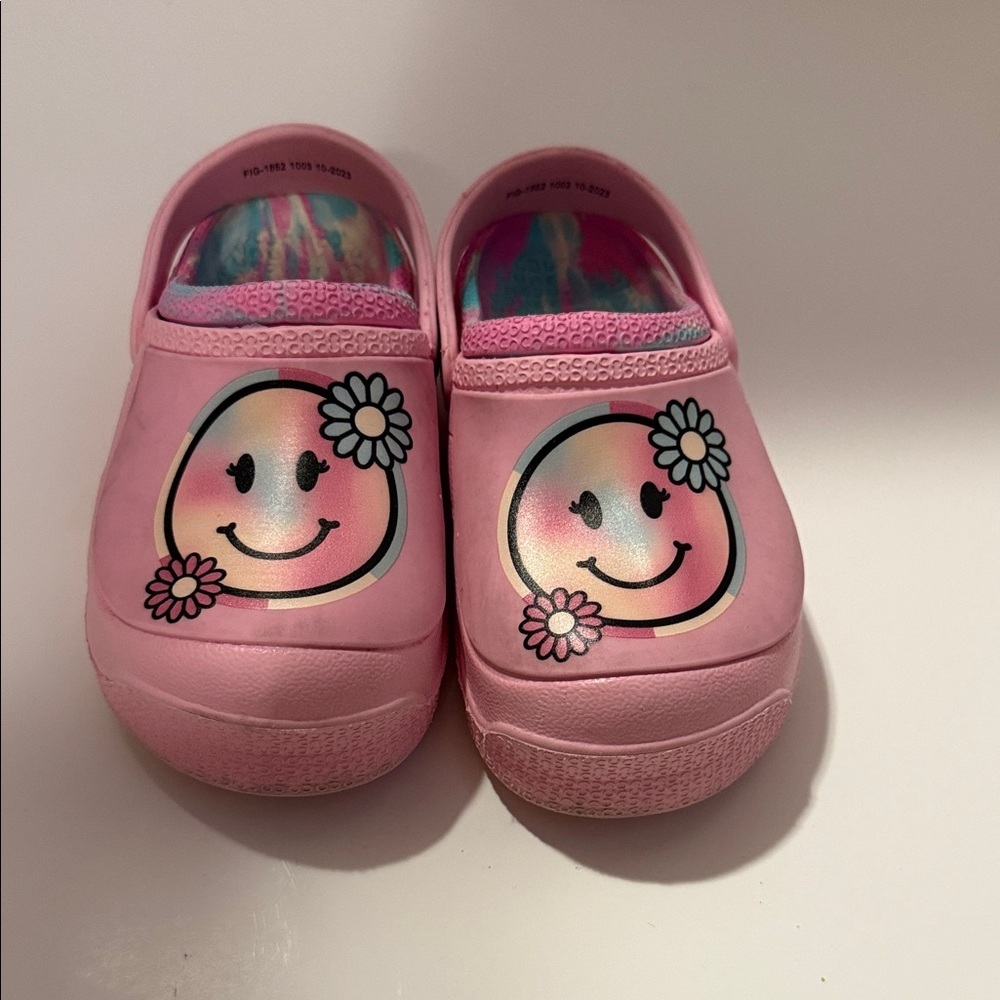 Pink clog slides in a girls size 12, with pastel swirl in sole and nonslip.